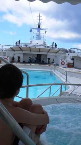 Ronnie at the hot tub, overlooking the pool